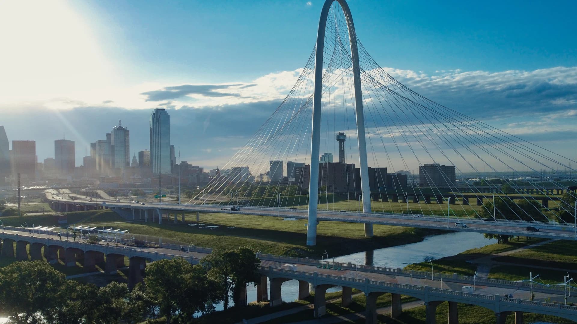 The Dallas skyline and Reunion Tower behind the Margaret Hunt Hill Bridge over the Trinity River