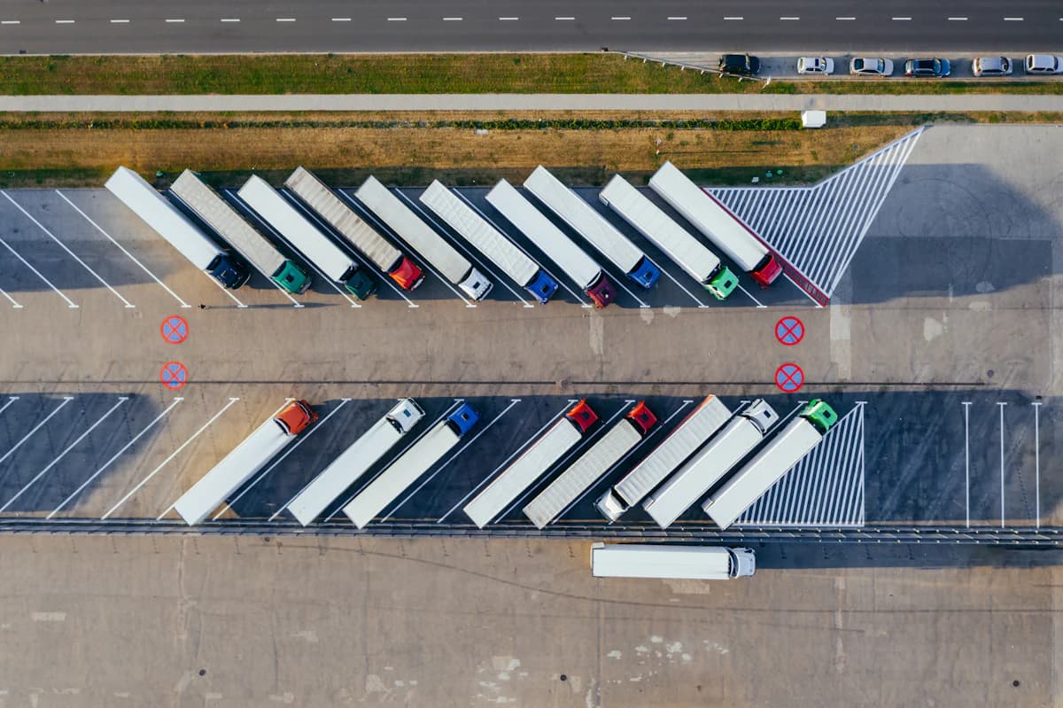 Semi trucks parked in rows, seen from above